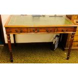 A late Victorian mahogany writing desk, circa 1890, slight oversailing top with a leather inlay