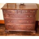 A George III oak chest of drawers, circa 1780, rectangular slight oversailing top with moulded edge,