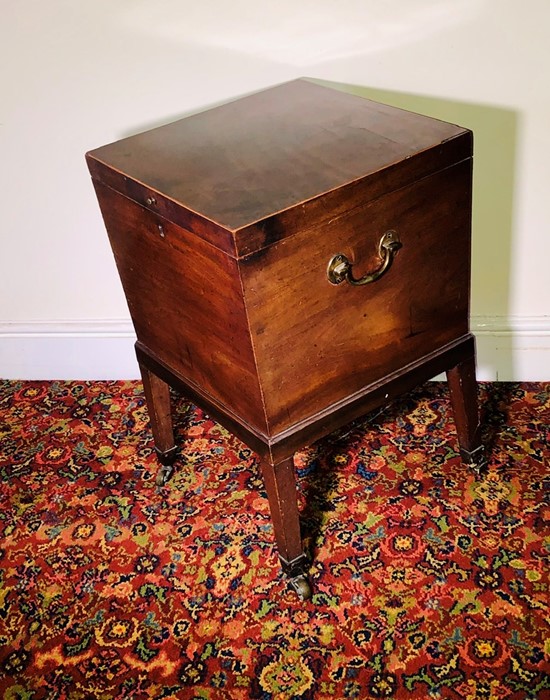 A George III mahogany wine cooler, circa 1770, in square form, lid opening to lead line interior