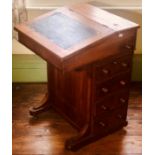 A Victorian walnut and satinwood inlay davenport desk, circa 1860, hinged slope inset with green
