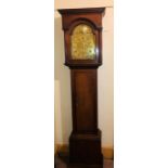 A George III oak crossbanded 8-day longcase clock, circa 1770, dental pediment above an arched brass
