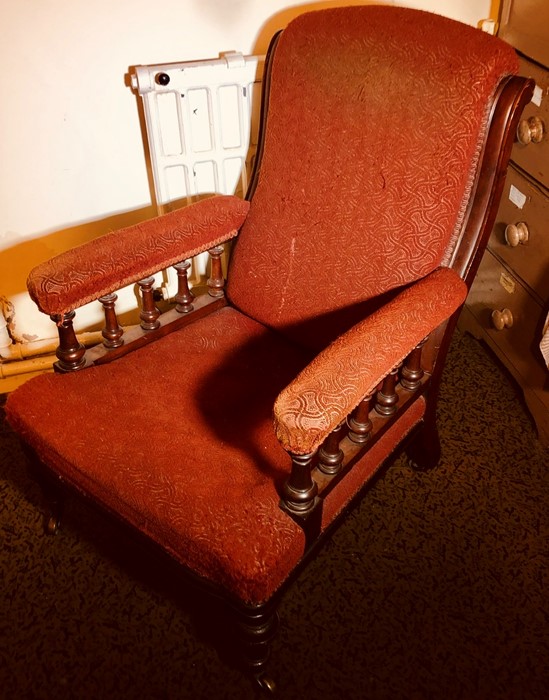 A late Victorian Aesthetic mahogany open armchair, line carved frame, padded arm rests, seat and