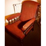 A late Victorian Aesthetic mahogany open armchair, line carved frame, padded arm rests, seat and