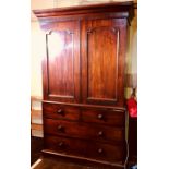 A Victorian mahogany linen press, circa 1860, moulded cornice above two moulded arch panel doors,