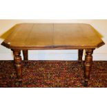 A late Victorian oak extending dining table, circa 1890, octagonal moulded edge top, wind up