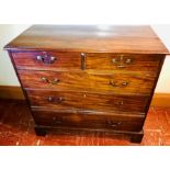 A George III mahogany chest of drawers, circa 1780, slight oversailing moulded edge top, above two