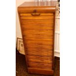 A 1920's oak tambour filing cabinet. 116cm H x 44cm W x 36cm D Condition report: Good overall