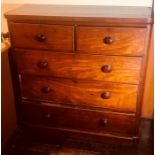 A Victorian mahogany chest of drawers, circa 1870, slight oversailing smooth edge top above two