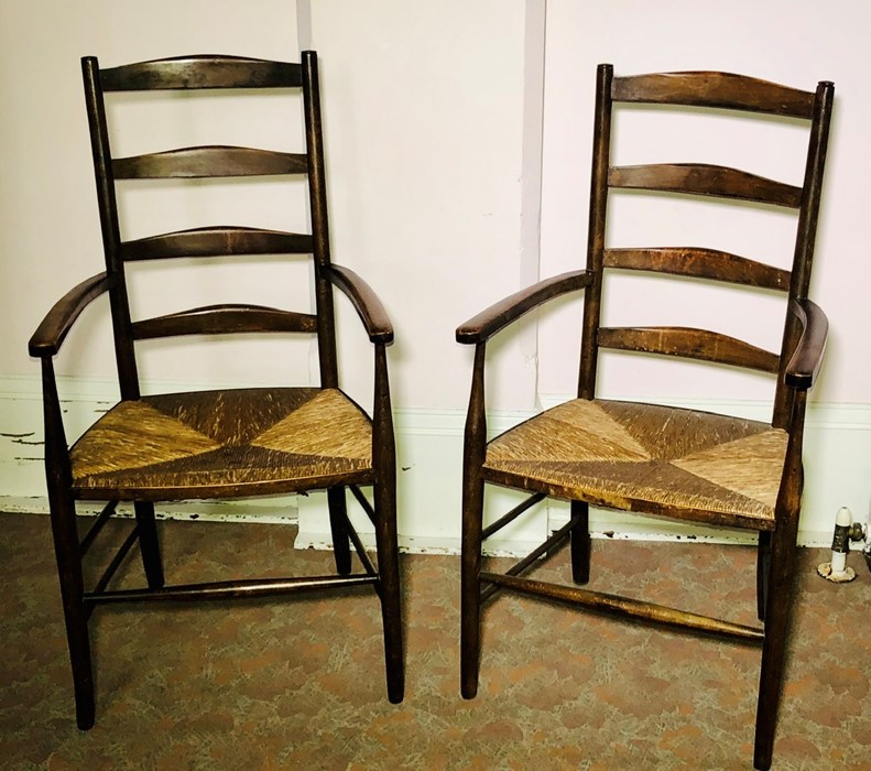 A pair of Arts & Craft Cotswold School ash ladder back chairs, circa 1900, curved back rails on a