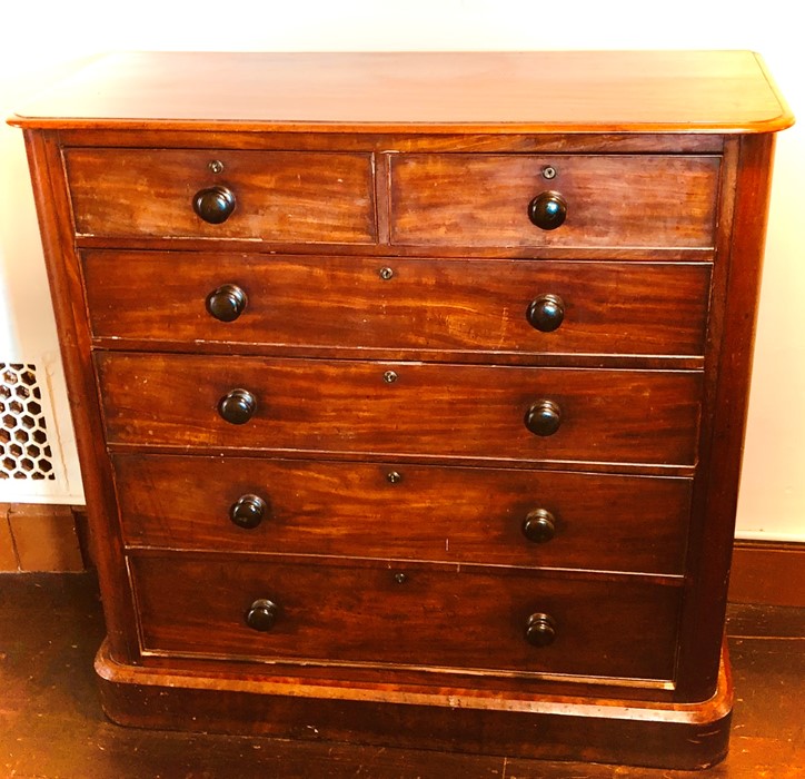 A Victorian mahogany chest of drawers, circa 1870 rectangular curved moulded edge front above two