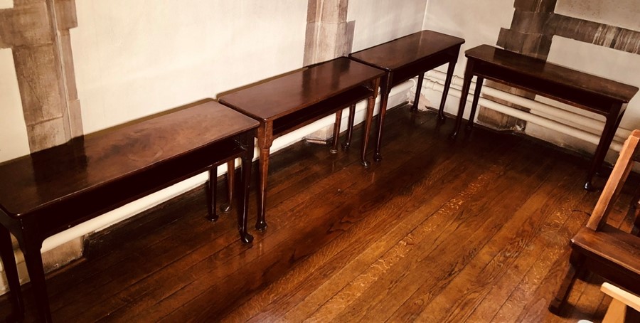 A set of four similar George IV mahogany console tables, circa 1825, rectangular curved edge top