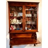 A George III mahogany wall fitted bookcase bureau, circa 1790, moulded pediment on a pair of