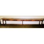 A 19th Century grain pine farmhouse long table, rectangular top, above six drawers to the frieze,