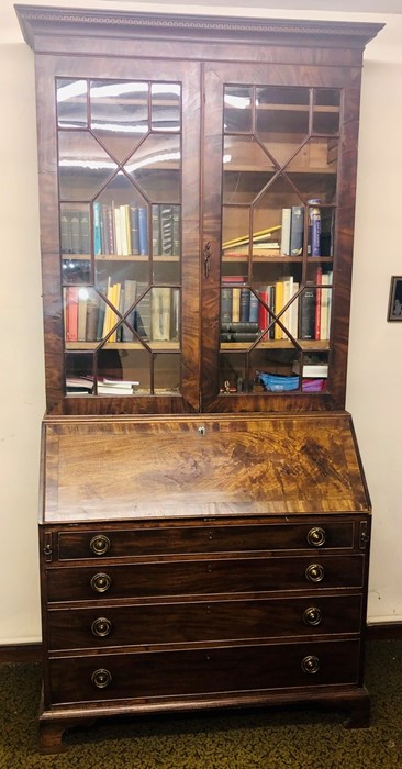 A George III mahogany glazed bookcase on bureau, circa 1780, in a Thomas Chippendale manner,