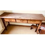 An early 20th Century pine sideboard, rectangular oversailing top above three frieze drawers, raised