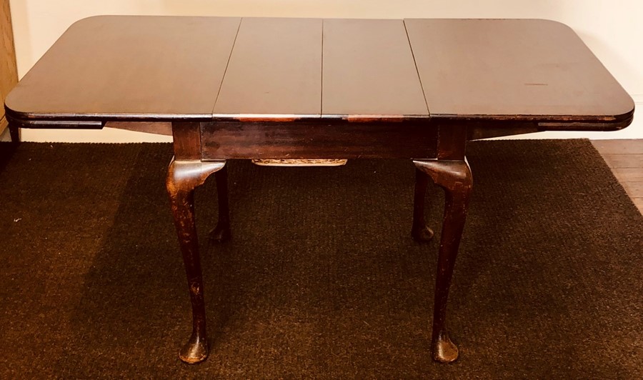 A George III revival mahogany drawleaf table, in Thomas Chippendale design, raised on tapered