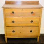 An Edwardian oak chest of drawers, circa 1905, quarter gallery back, slight oversailing top above