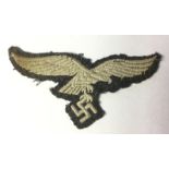 WW2 Third Reich Luftwaffe enlisted man's breast eagle. Uniform removed example.