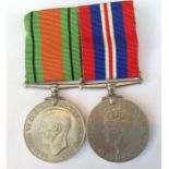 WW2 British War Medal and Defence Medal mounted on a bar complete with ribbons.