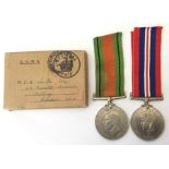 WW2 British Defence Medal and War Medal with original ribbons in box of issue. No slip. Name on