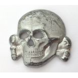 WW2 Third Reich 1936 pattern SS Deathshead cap badge. Maker marked RZM M1/24. No prongs. Traces of