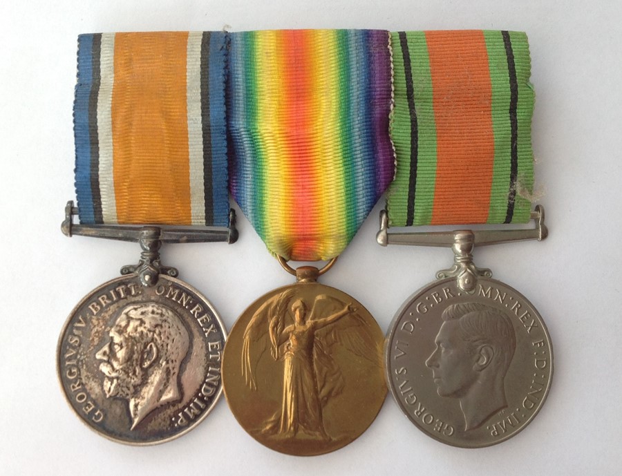 WW1 British War Medal and Victory Medal and WW2 Defence Medal mounted on a bar with original ribbons