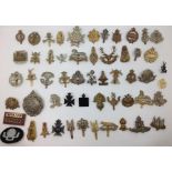 A collection of restrike WW1/WW2 British Army cap badges. Approx 50 in total to include SAS, AAC,