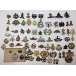 WW1/WW2 British cap badges and collar dogs. Over 50 in total to include  RTR, RM's, Pioneer Corps,