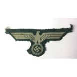 WW2 Third Reich Heer enlisted mans early Bevo machine woven breast eagle. Uniform removed example.