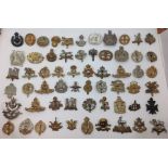 A collection of restrike WW1/WW2 British Army cap badges to include Leicesters, FANY, RA, Notts &