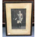 A signed photograph of Field Marshal Lord Kitchener of Khartoum (1850-1916),  a large sepia-toned
