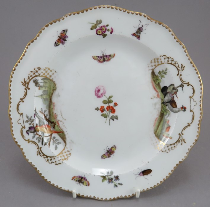 A late nineteenth century porcelain Meissen porcelain plate painted with bird vignettes and insects,