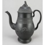 An early nineteenth century black basalt coffeepot and cover, c.1810. It has classical details of