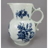 An eighteenth century blue and white transfer-printed porcelain Worcester mask jug, c. 1760-70. It