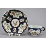 An eighteenth century  porcelain Worcester tea bowl and saucer, c. 1760. It is decorated with the