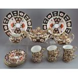 A twentieth century century Royal Crown Derby Imari part tea service. To include: a teapot and