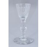 An 18th Century clear glass wine, circa 1785, facet cut bowl and single knop stem, ground pontil,