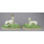 A pair of early nineteenth century Staffordshire porcelain deer figures, c. 1830.  One depicts a