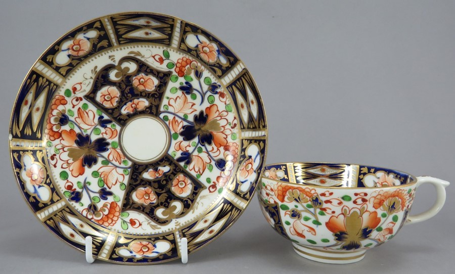 An early nineteenth century hand-painted porcelain Derby cup and saucer, c.1820. It is decorated