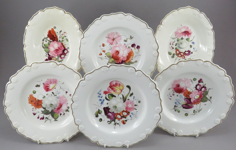 A group of early nineteenth century hand-painted porcelain moulded dessert plates and two single-