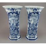 Two nineteenth century tin glazed earthenware delft large vases c. 1820-50. They are of moulded