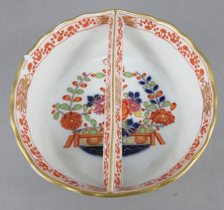 A late eighteenth century Meissen porcelain circular dish with central bar-type handle c. 1790-1810.