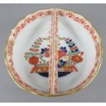 A late eighteenth century Meissen porcelain circular dish with central bar-type handle c. 1790-1810.