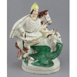 A late nineteenth century Staffordshire figure group, c. 1860-70. It depicts St. George and the