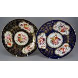 A pair of early nineteenth century hand-painted Coalport plates, c. 1810-20. Each is decorated