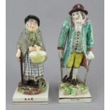 A matched pair of early nineteenth century Staffordshire figures, c. 1820.  They both depict Old