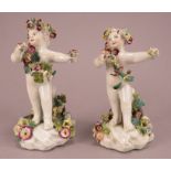 A pair of Derby porcelain cherub figures with encrusted flowers, all hand-painted, c. 1770.