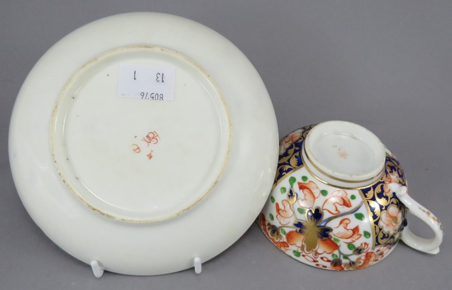 An early nineteenth century hand-painted porcelain Derby cup and saucer, c.1820. It is decorated - Image 2 of 2