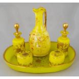 An early 20th Century composite six piece European yellow glass dressing table set, comprising