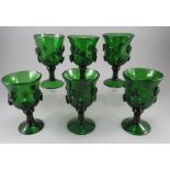 A group of late eighteenth, early nineteenth century green glass roemers with pinched roundels,